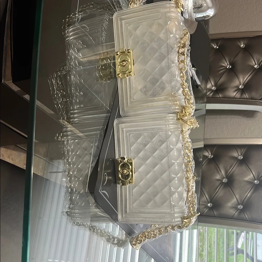 Elegant transparent padded bag with golden details are two bags for only 35